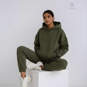 Bottle green oversized hoodie for women styled in cozy streetwear look with relaxed fit and soft cotton fabric.